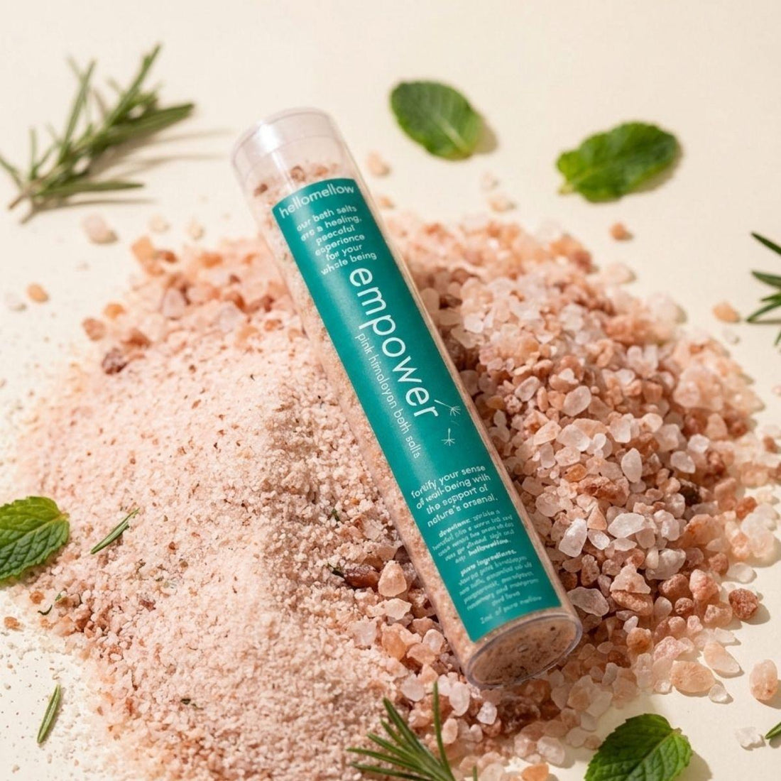 one shot bath salt in empower aroma sitting a mound of himalayan pink salt