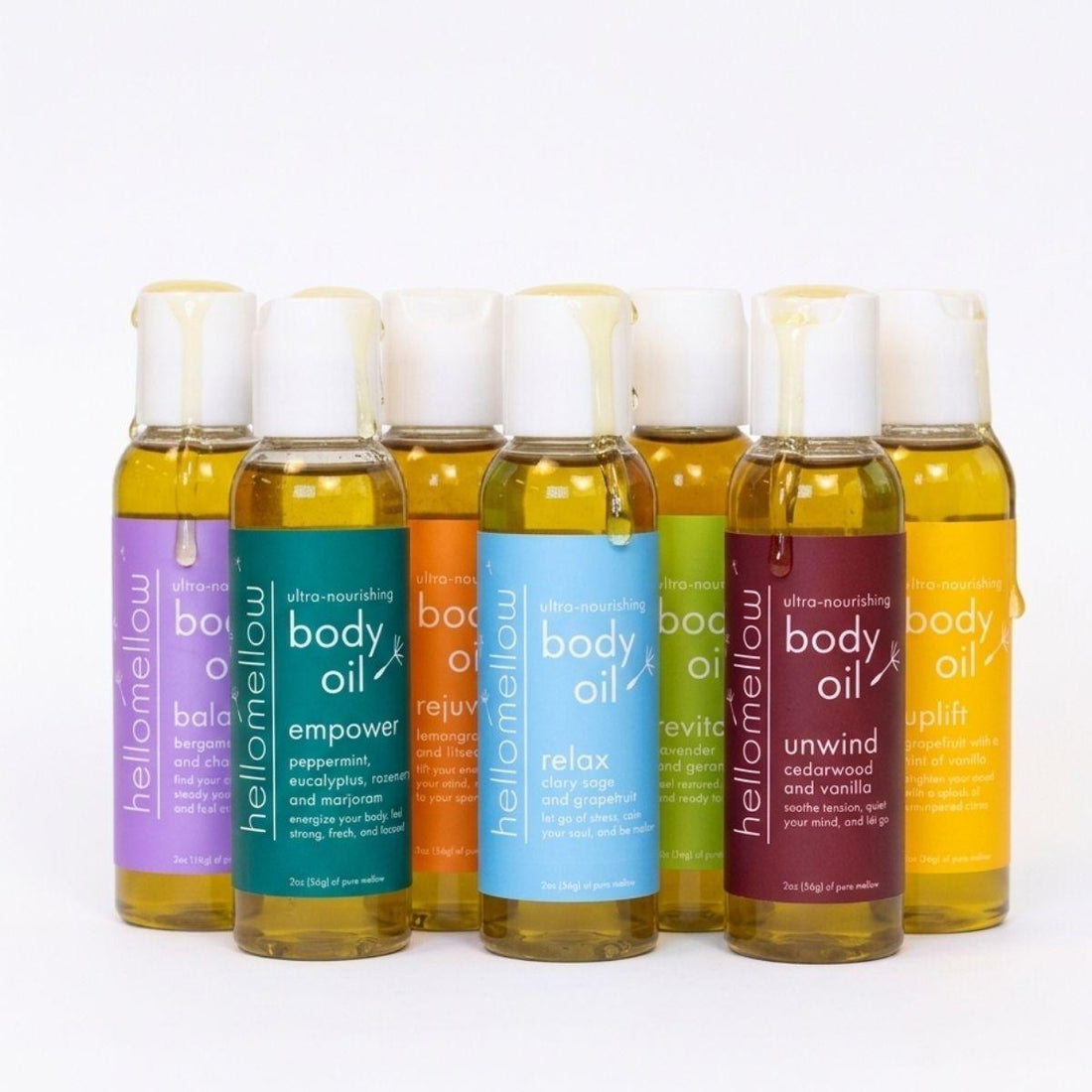 mini body oil all aromas full lineup with a white background in a staggered formation