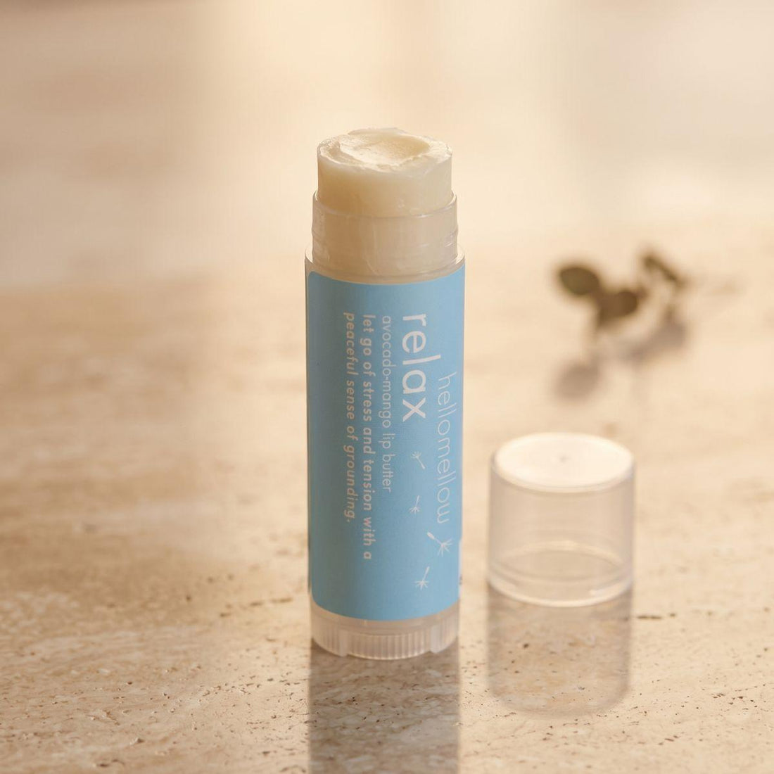 relax lip butter shown open or ready for use in its real packaging