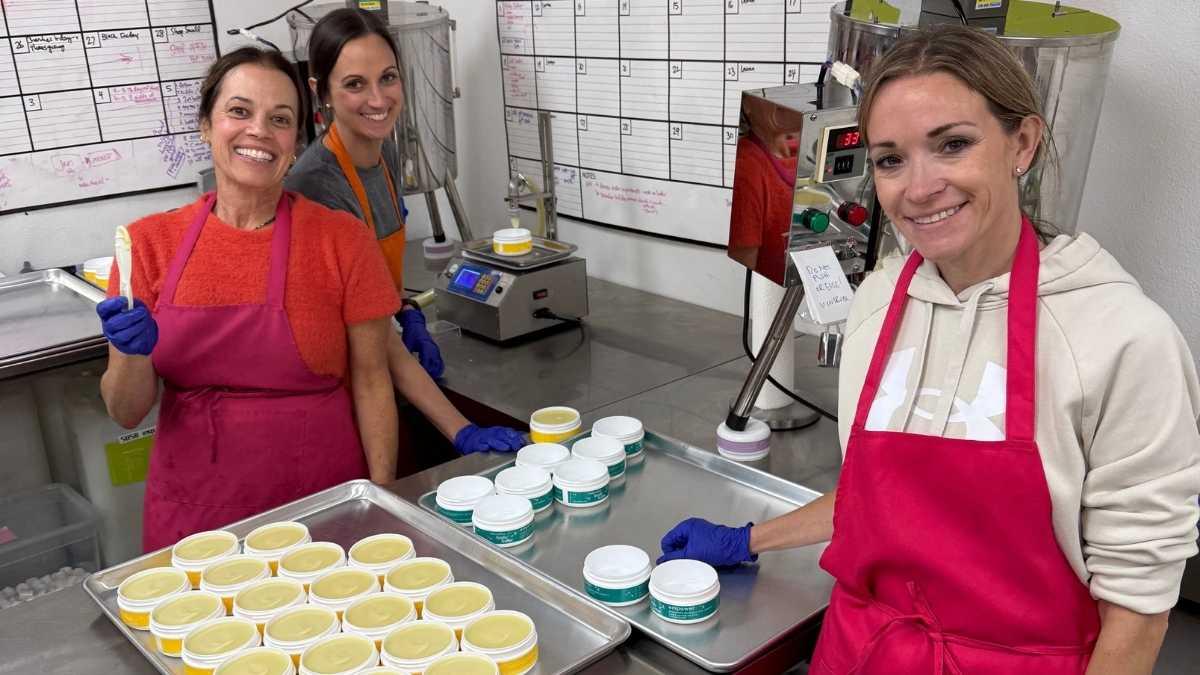 hands preparing a fresh batch of handmade body butter in the hellomellow workshop in eagle, idaho.