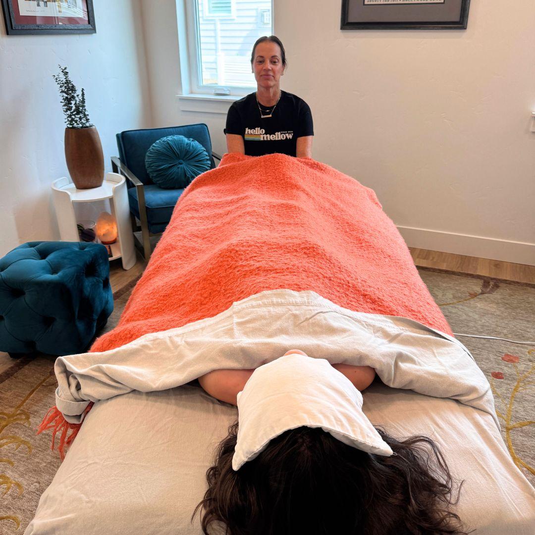 Tracy using hellomellow body oil on her massage client 