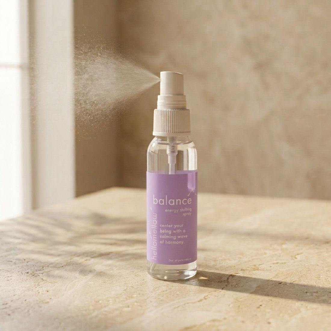 balance energy shifting spray bottle standing front-facing on a warm neutral surface