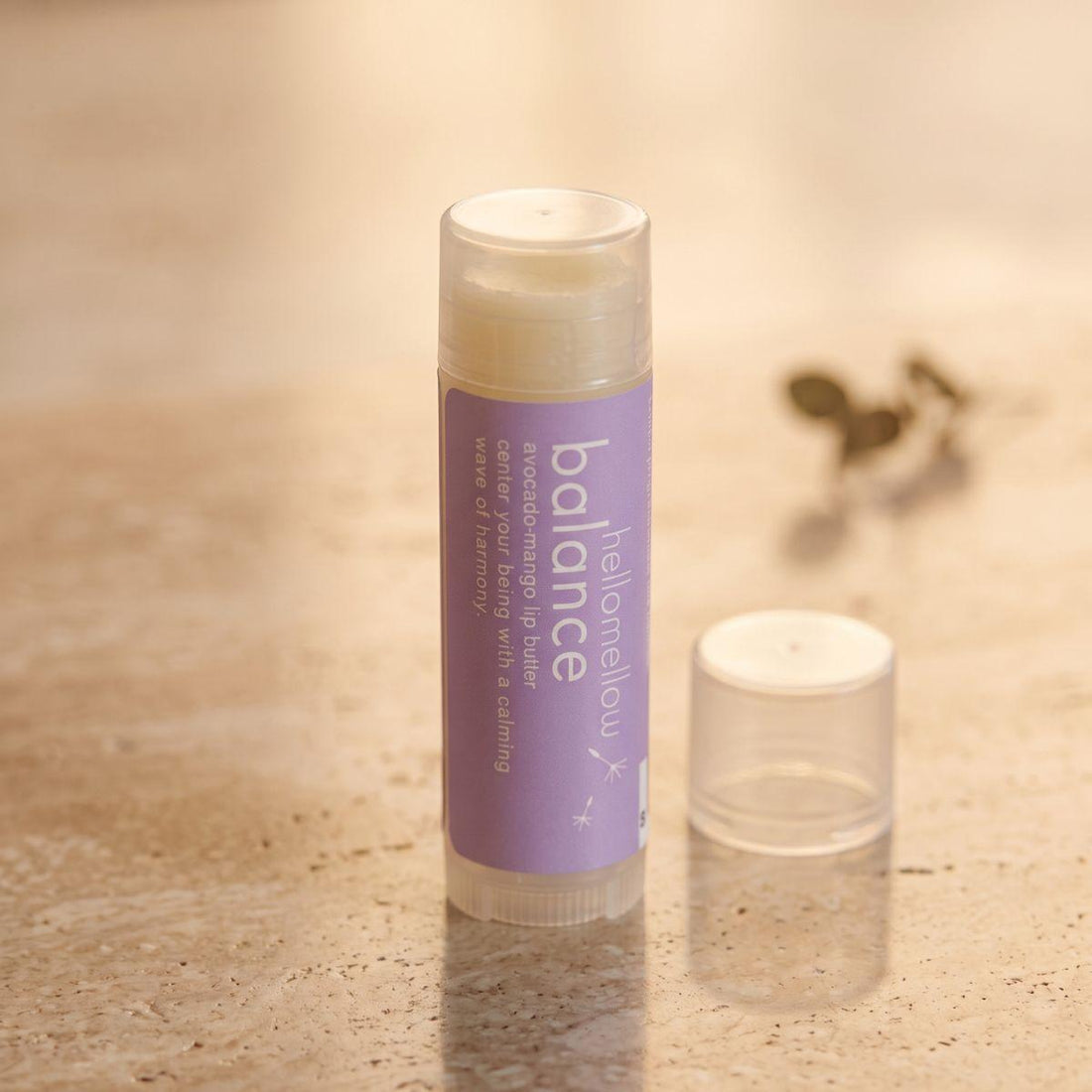 balance lip butter shown open or ready for use in its real packaging