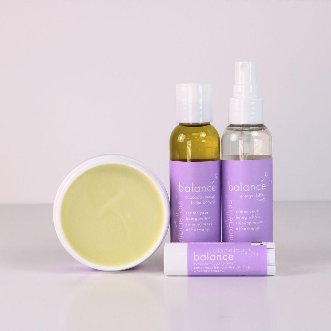 balance vacay vibe full product lineup with an open body butter, body oil, energy shifting aromatherapy spray, lip butter 