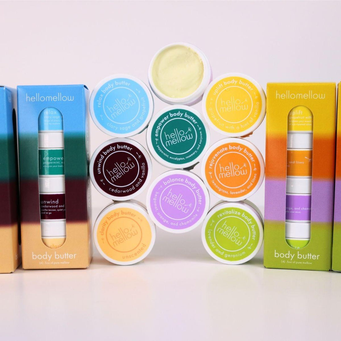 body butter try me set both bright days and deep breath pictured together with a pyramid stack of mini body butters in varying aromas