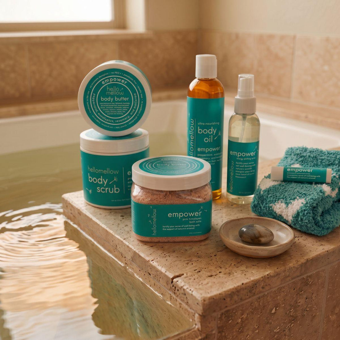 bath salts beside a warm bath with a folded towel and simple ceramic detail