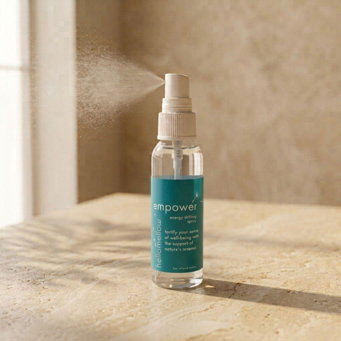 empower energy shifting spray bottle standing front-facing on a warm neutral surface