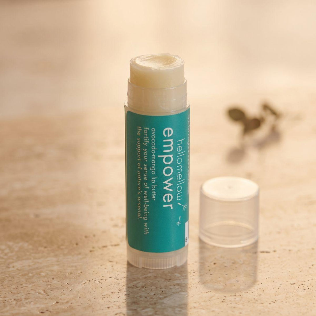 empower lip butter shown open or ready for use in its real packaging