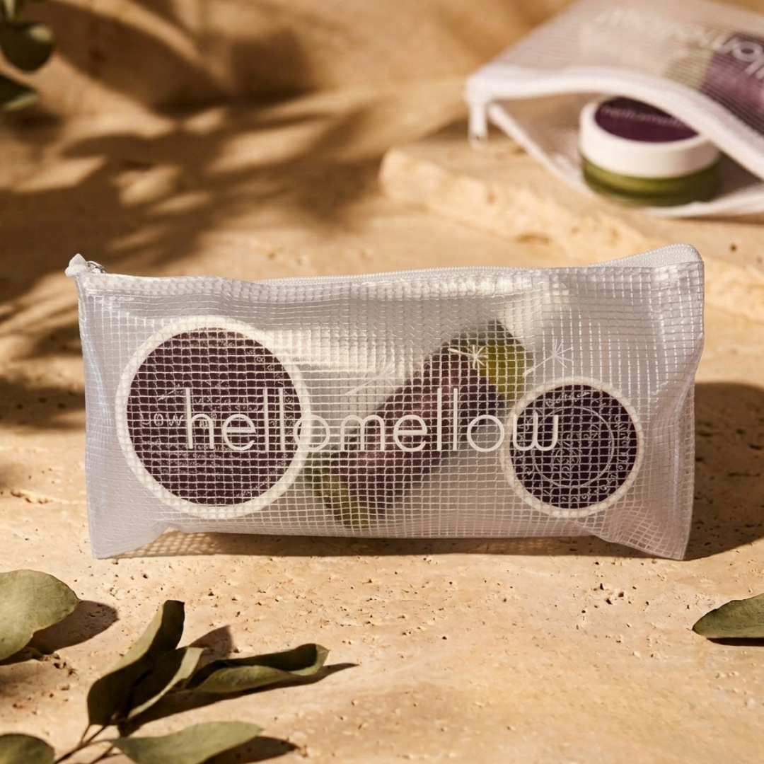 the essential routine mini in unwind: body scrub, body oil and body butter with the free water-resistant bag