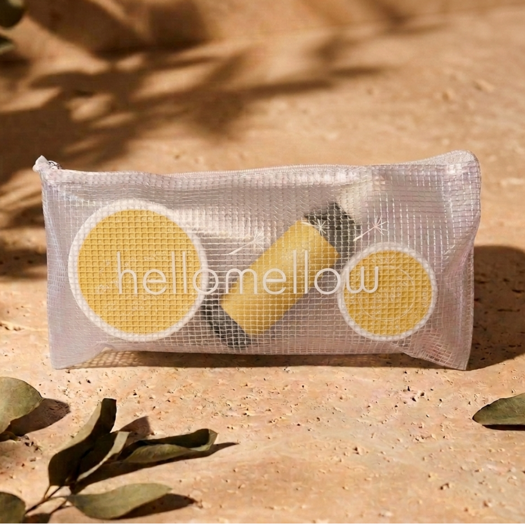 the essential routine mini in uplift: body scrub, body oil and body butter with the free water-resistant bag