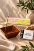 mellow palo santo incense with a brown ceramic bowl and inspirational matches on a warm neutral surface
