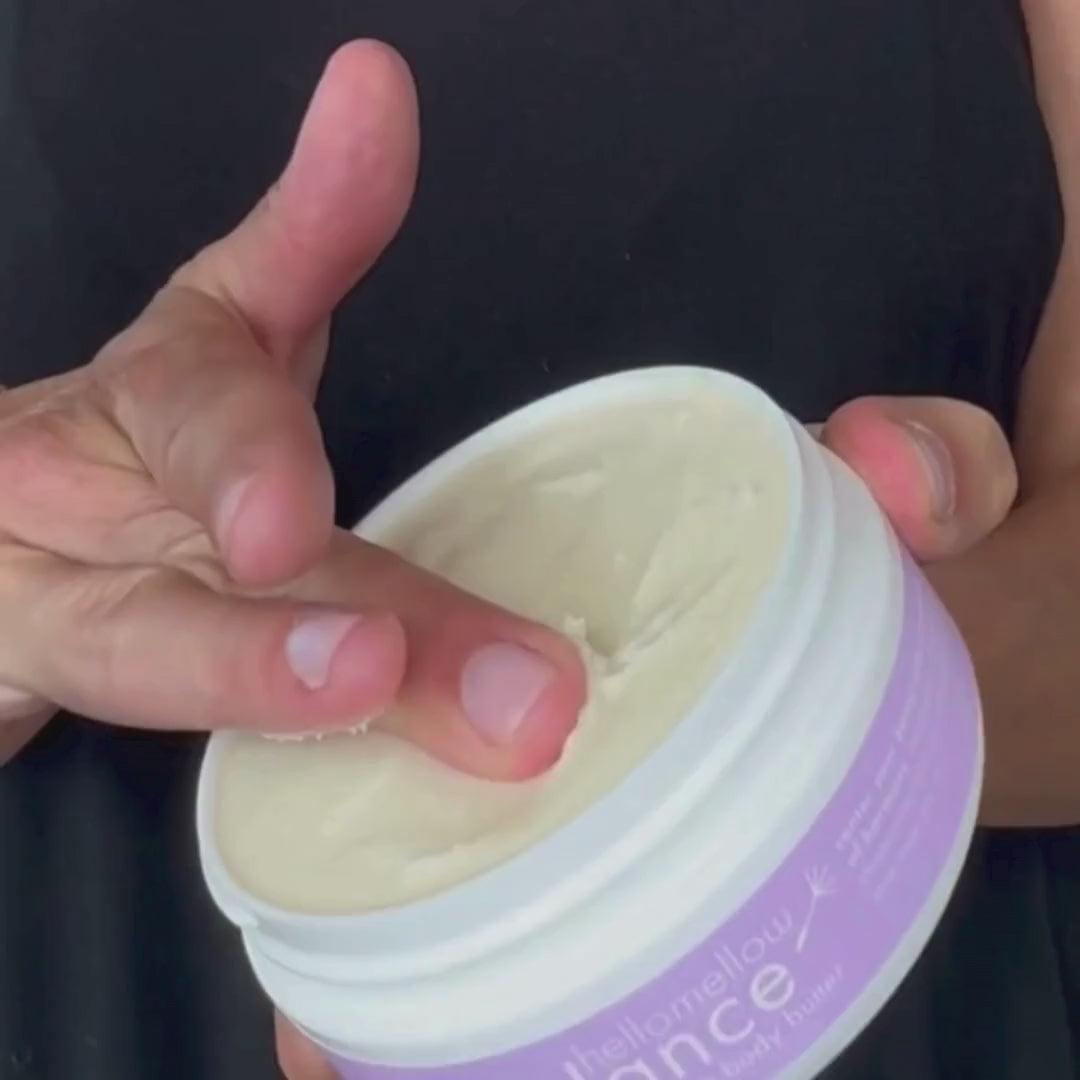 woman applying hellomellow body butter to her skin