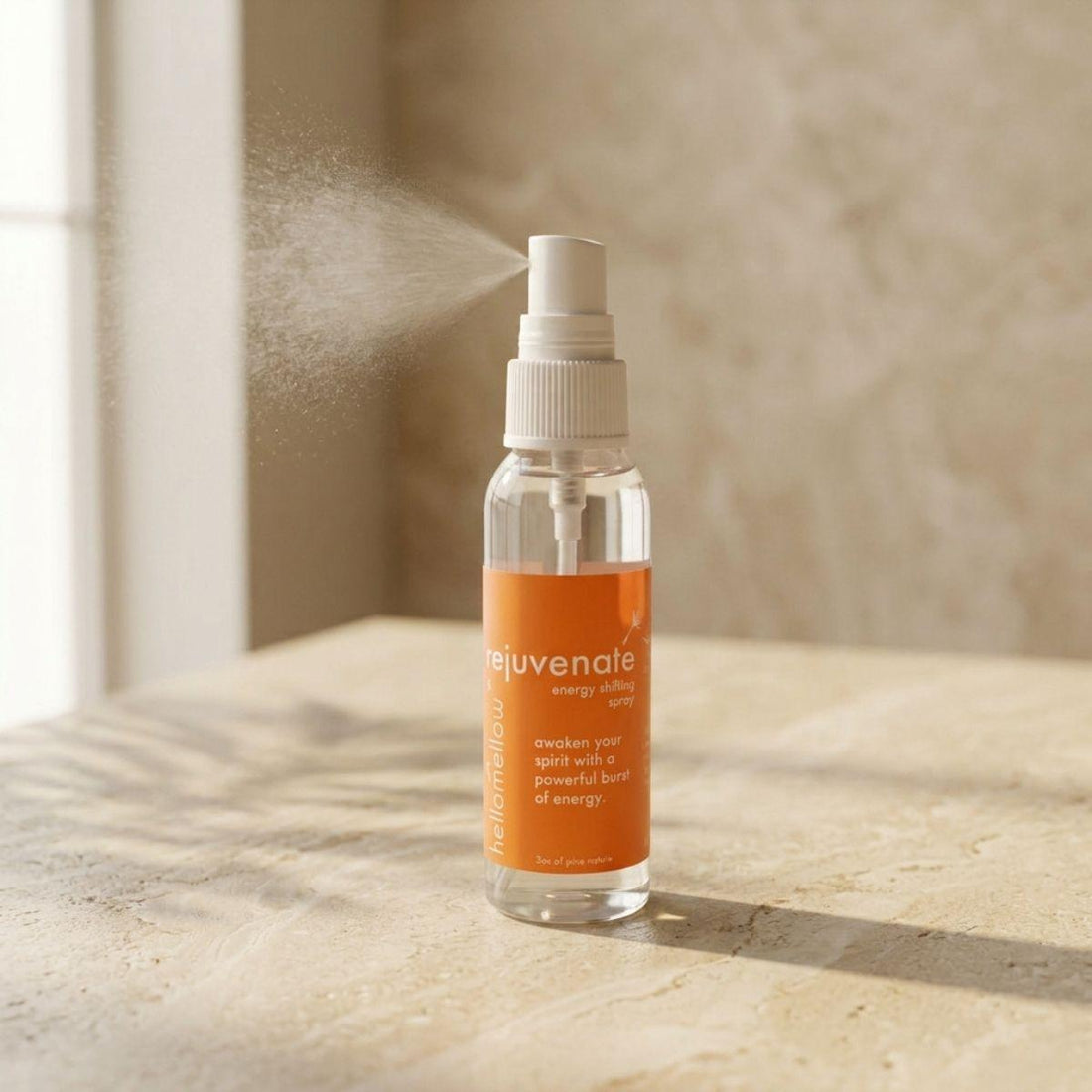 rejuvenate energy shifting spray bottle standing front-facing on a warm neutral surface