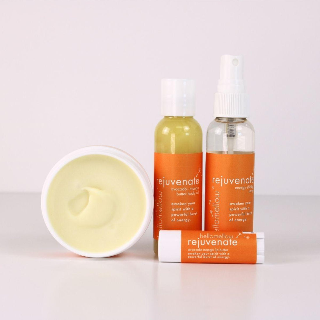 rejuvenate vacay vibe full product lineup with an open body butter, body oil, energy shifting aromatherapy spray, lip butter 