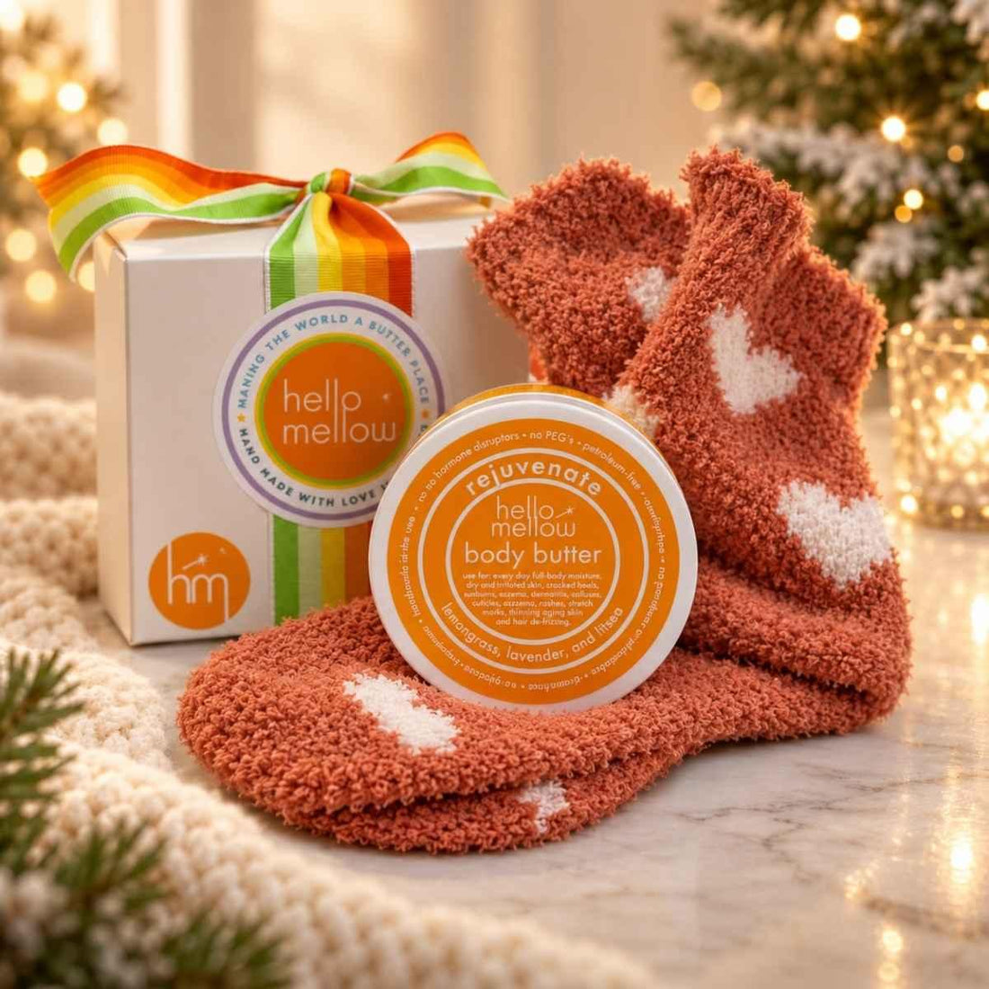 rejuvenate 2 oz body butter and cozy sock gift wrapped in holiday setting