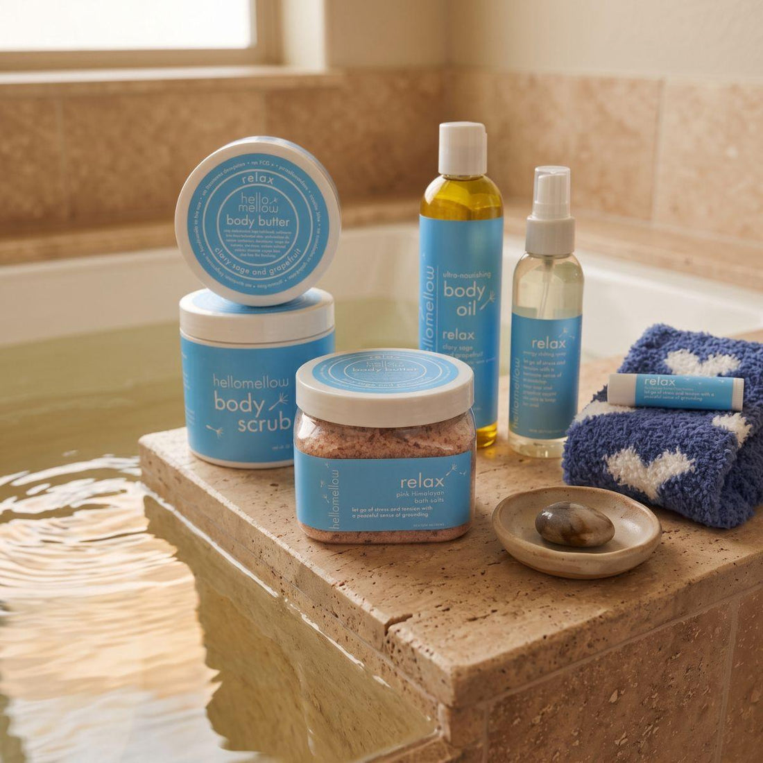 bath salts beside a warm bath with a folded towel and simple ceramic detail