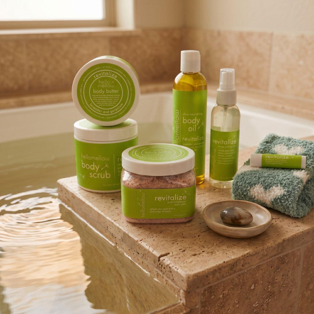 bath salts beside a warm bath with a folded towel and simple ceramic detail
