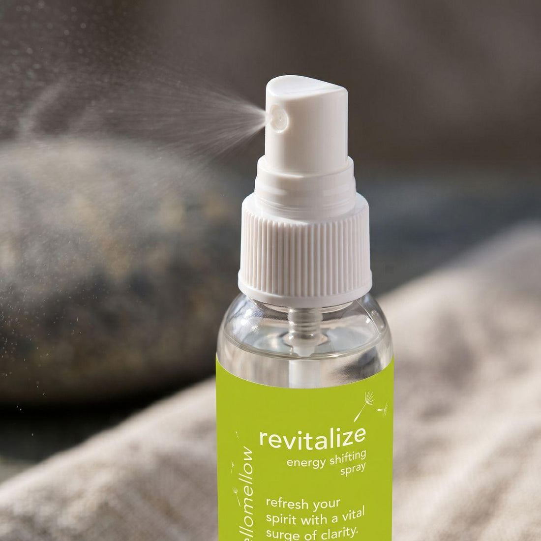 close view of the revitalize energy shifting spray bottle and its real spray top