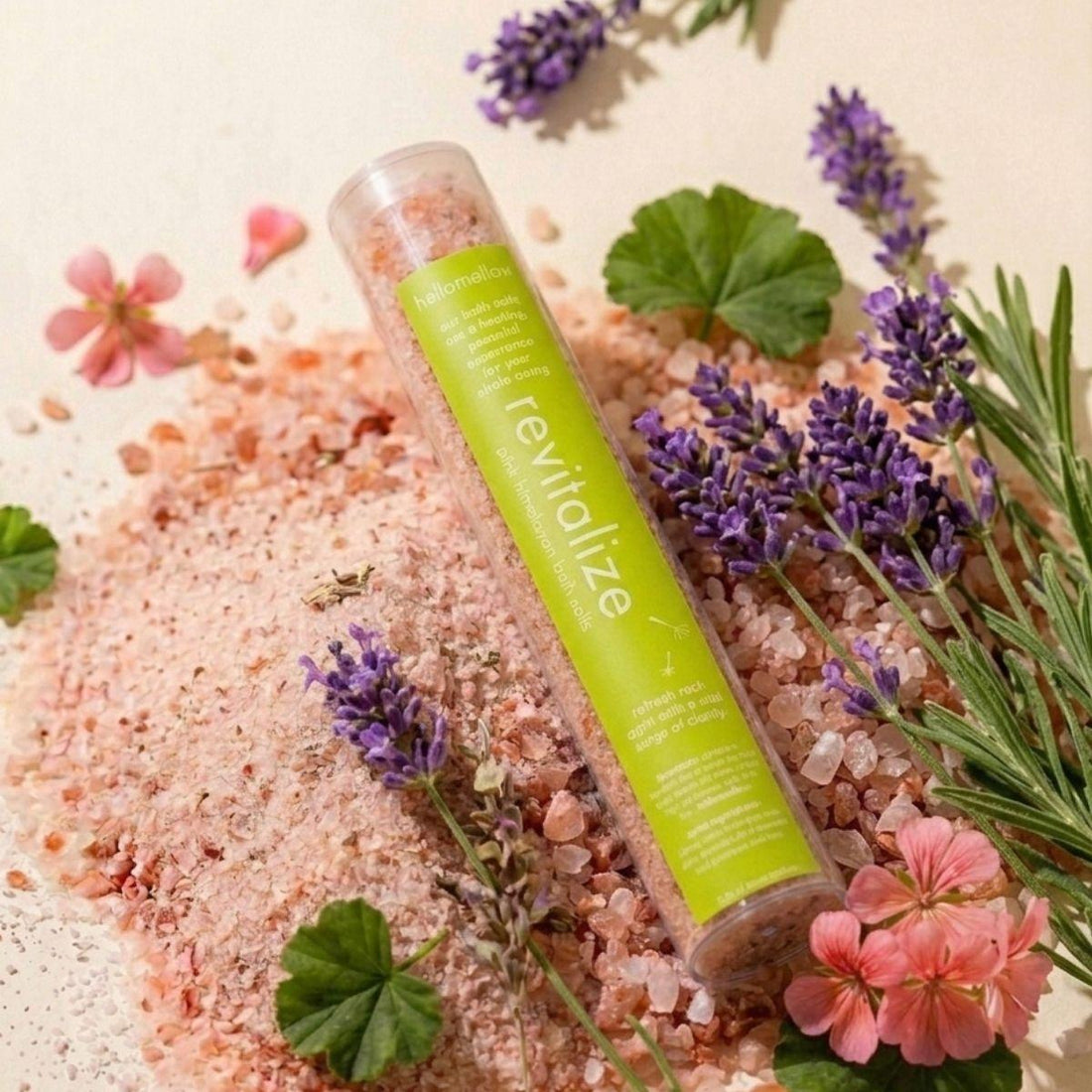 one shot bath salt in revitalize aroma sitting a mound of himalayan pink salt 