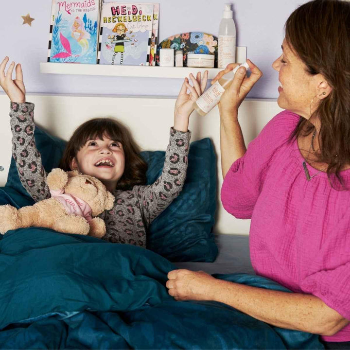 tracy and her daughter charlie spraying hellomellow kiddo sleepy time spray