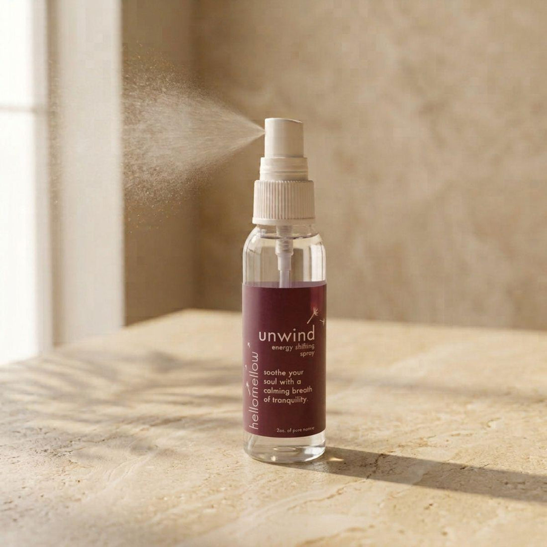 unwind energy shifting spray bottle standing front-facing on a warm neutral surface