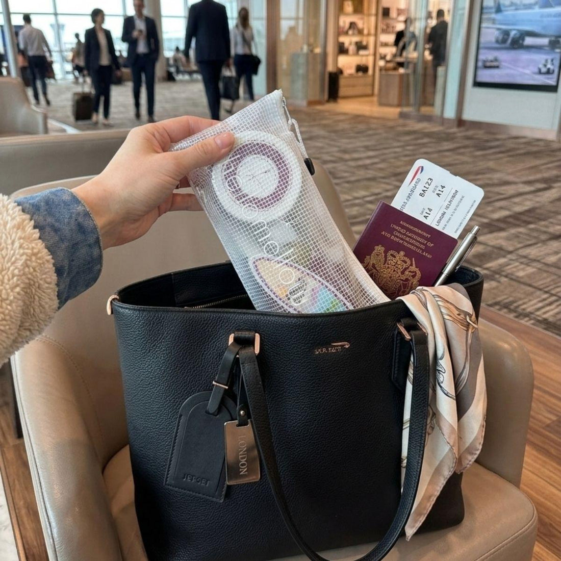 unwind vacay vibe travel bodycare set inside of a purse at the airport 