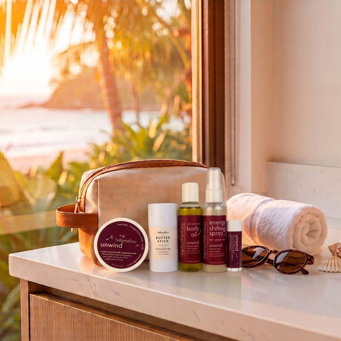 the deluxe vacay vibe in unwind with a sunset background body scrub body butter stick body oil aromatherapy spray and lip butter 