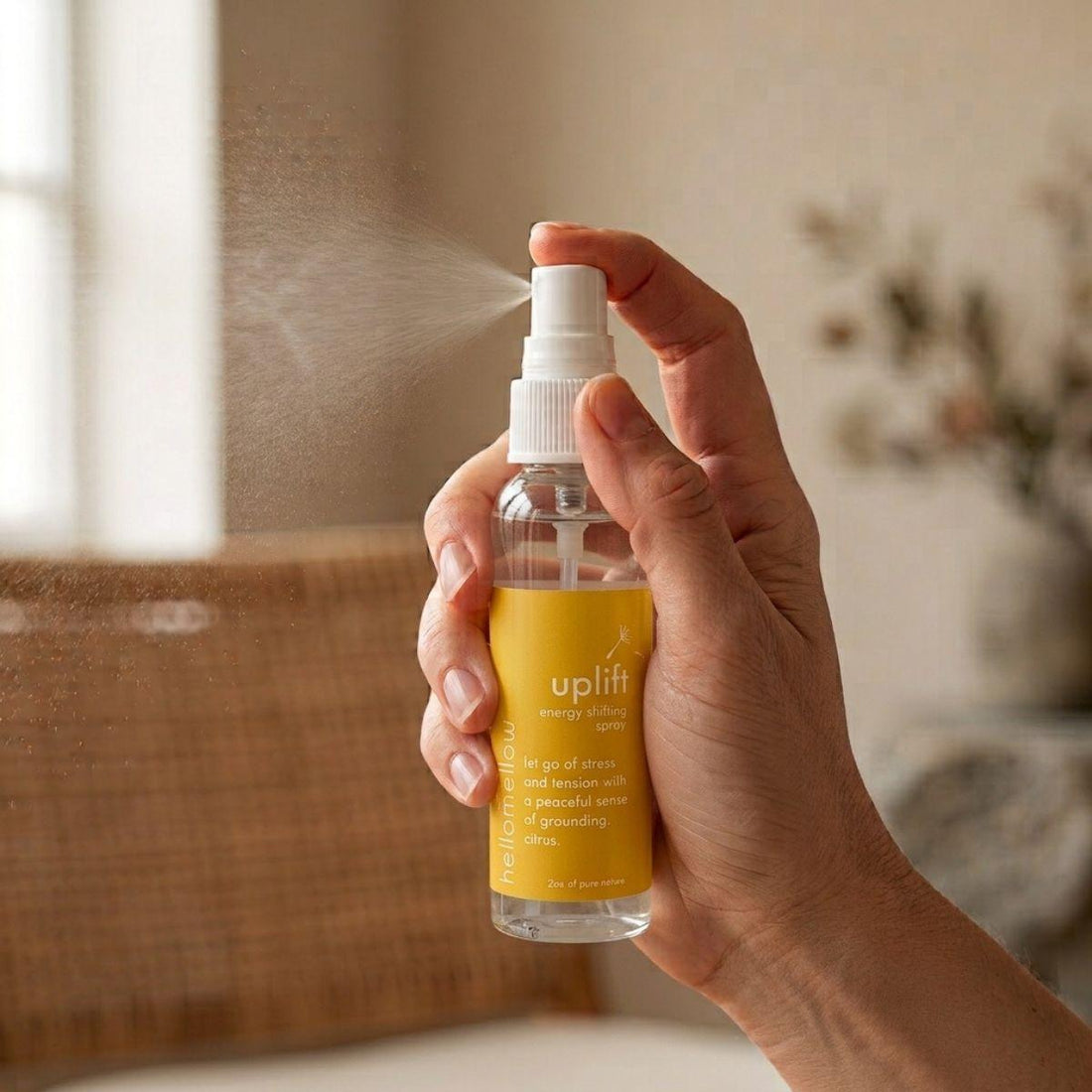hand spraying a fine mist from the relax energy shifting spray bottle