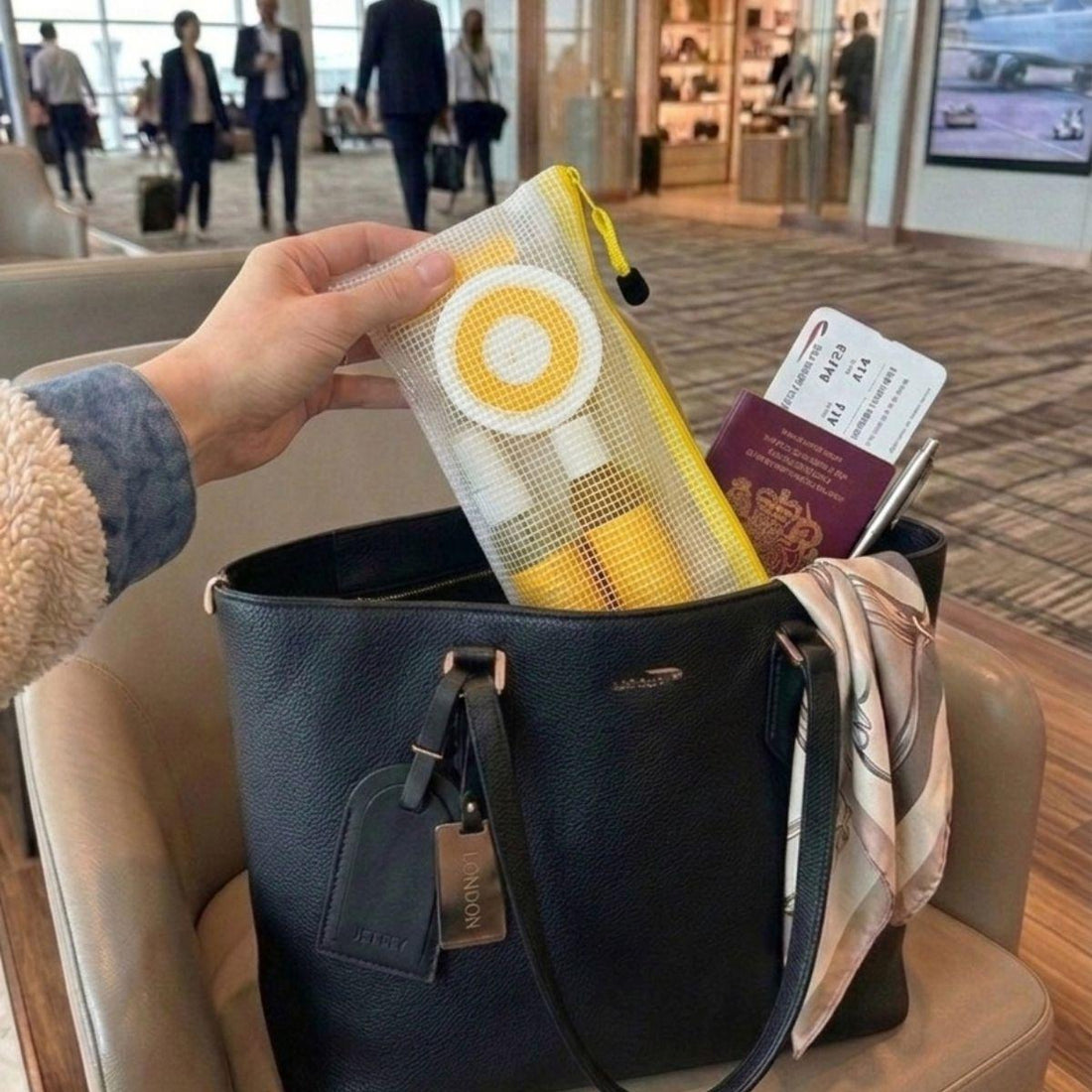 uplift vacay vibe travel bodycare set inside of a purse at the airport 