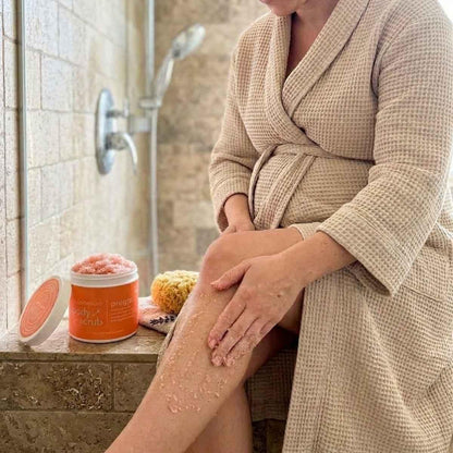 woman using hellomellow preggo scrub in shower